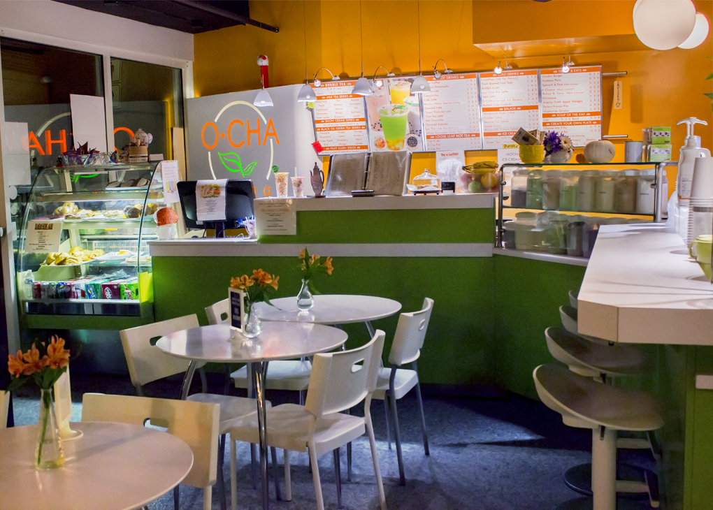 view of O-Cha's seating area and front counter with register