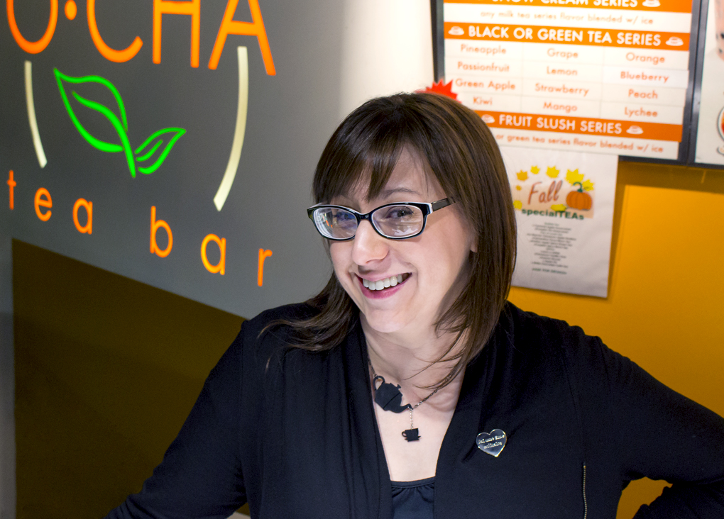 O-Cha's owner Mallie Majarais smiling standing behind front counter